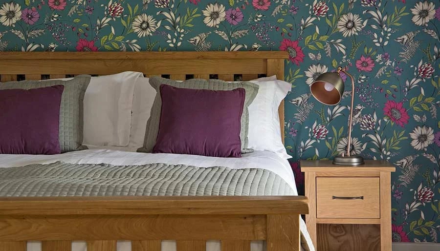 The bedroom at Mixon View, with statement wallpaper