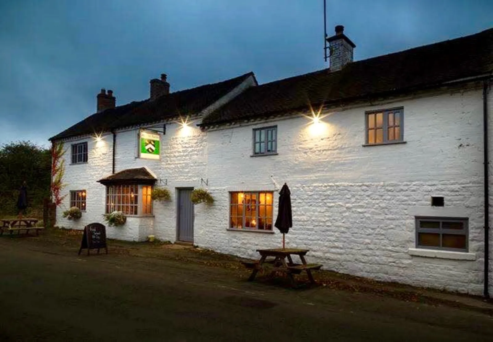 The Jervis Arms, our village local, lit up at dusk