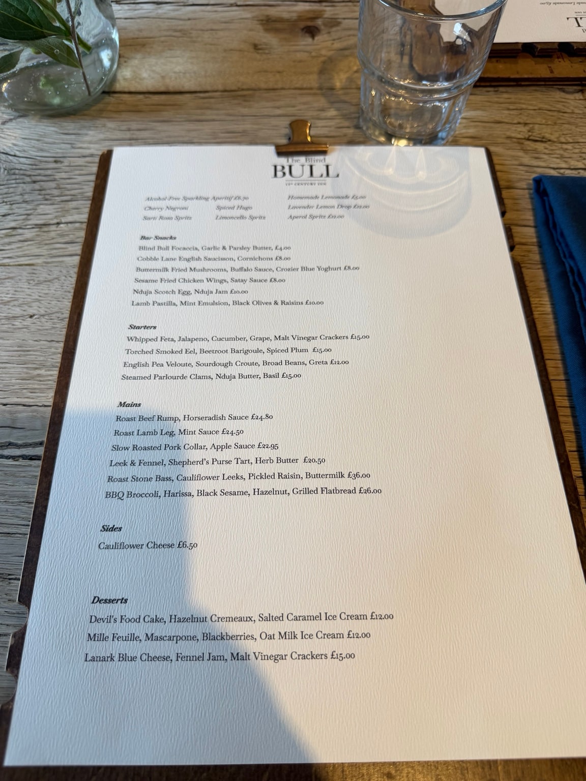 The Blind Bull's menu, clipped to a board on the table