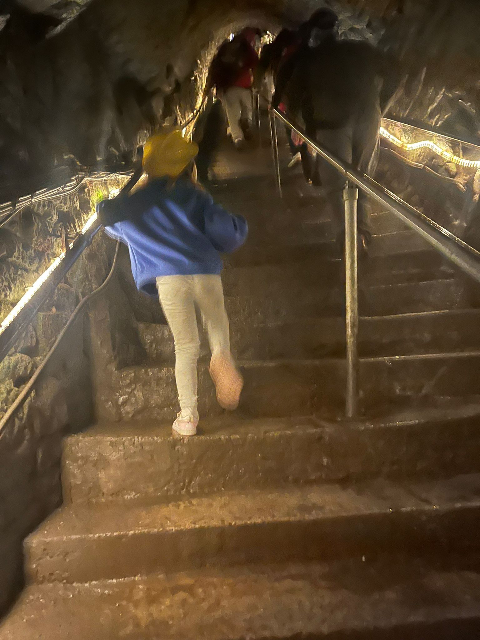Alice heading up the steps inside Speedwell Cavern