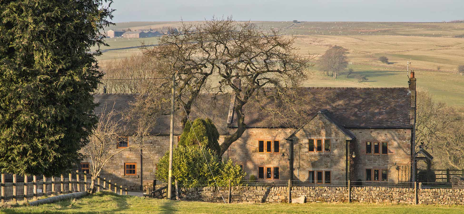 A dry-stone-walled track towards a stone barn near Lane Head Barns