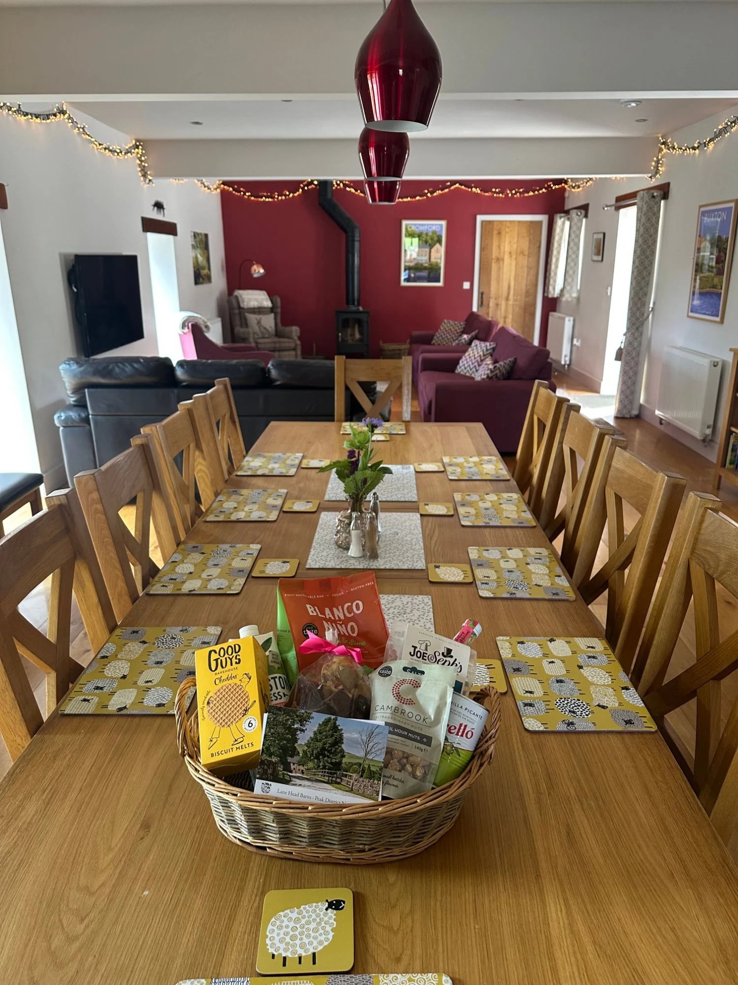 A welcome hamper of homegrown and local treats, laid out on the dining table at Morridge View
