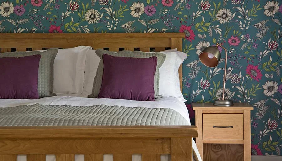 The bedroom at Mixon View, with statement wallpaper